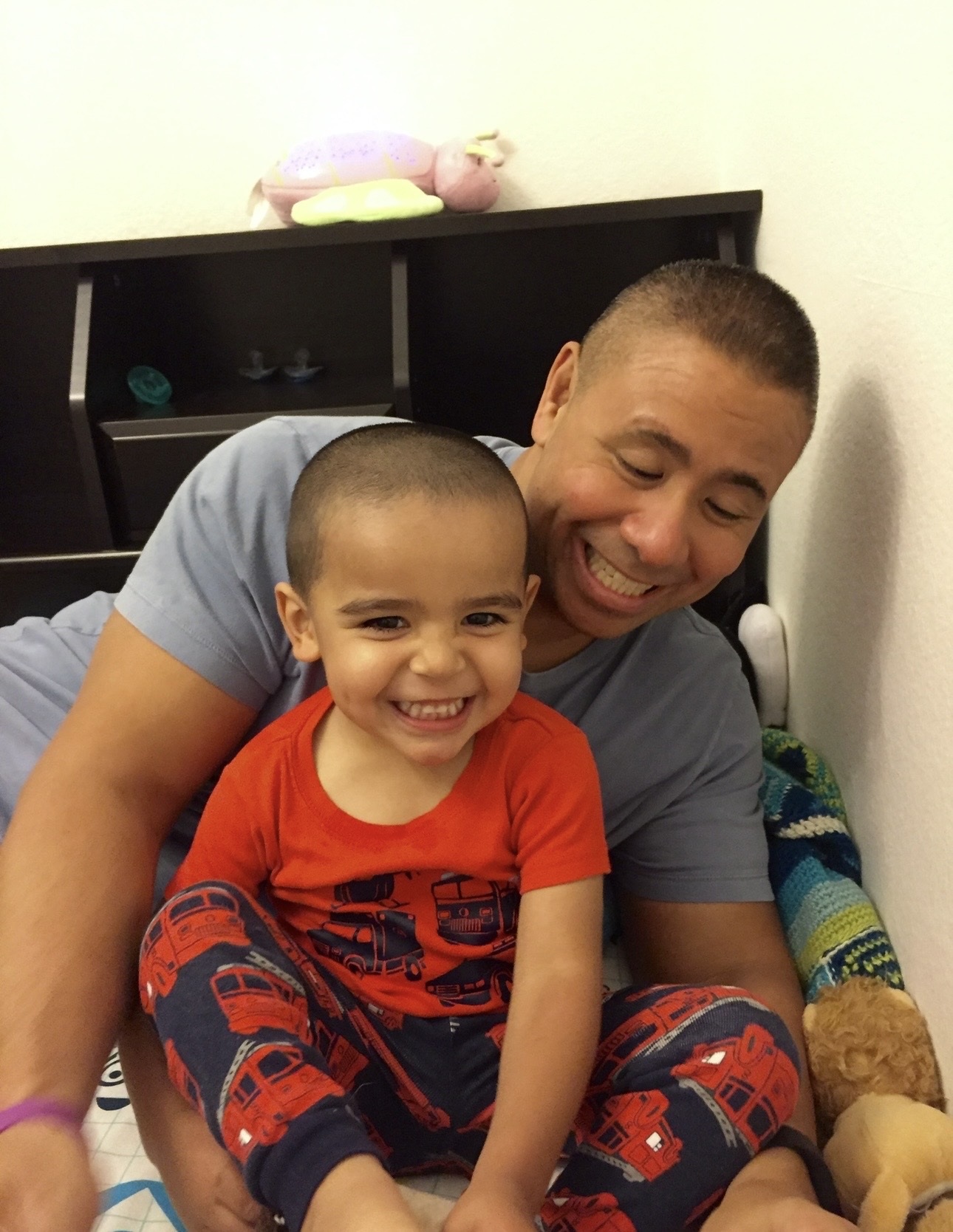 Rich Ouano with his foster son